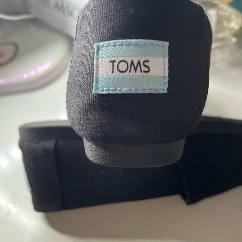 Black Toms slip on